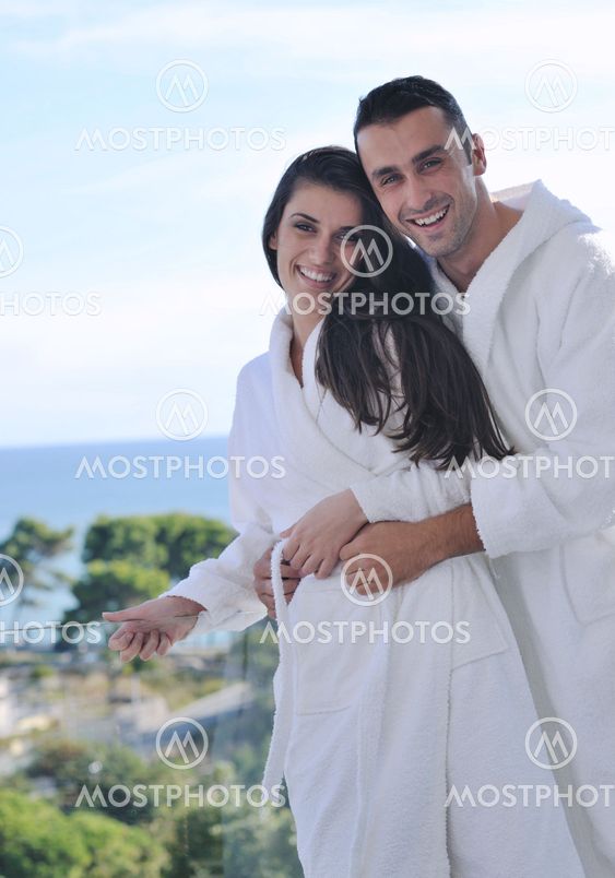 couple relaxing on balcony