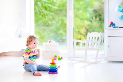 Little girl playing with a pyramid