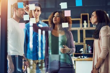 Business people, sticky notes and writing ideas in...