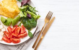 French omelet, avocado, tomatoes, avocado, and cheese on...