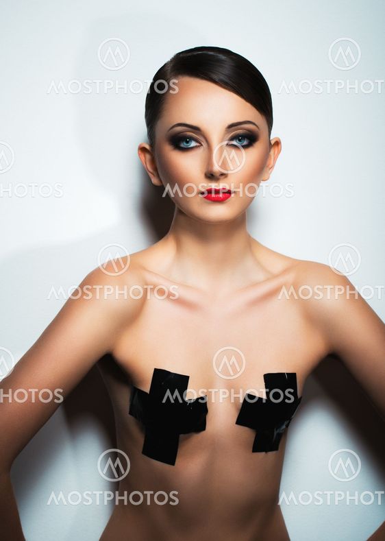 Portrait of a beautiful woman with a glamorous retro makeup