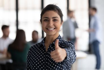 Portrait of happy Indian female business leader...