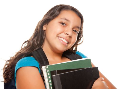 Pretty Hispanic Girl with Books and Backpack