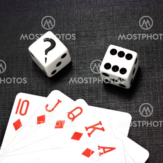 Dices and playing cards on a black background
