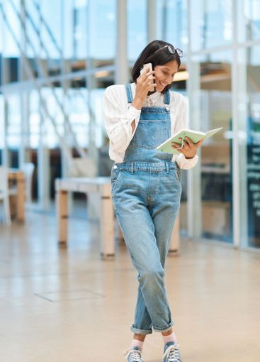 Phone call, notebook and businesswoman in office for...