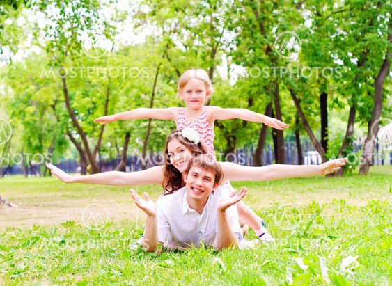 Family lying in the park