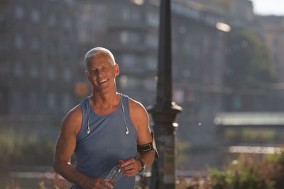 portrait of handsome senior jogging man