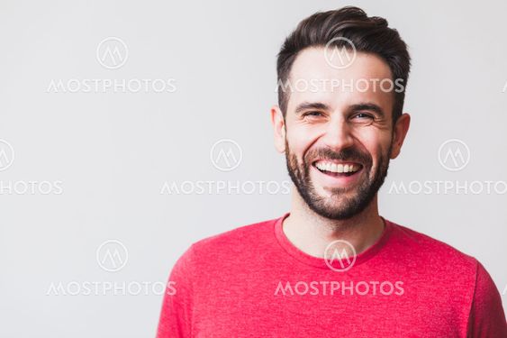 Handsome young man laughing