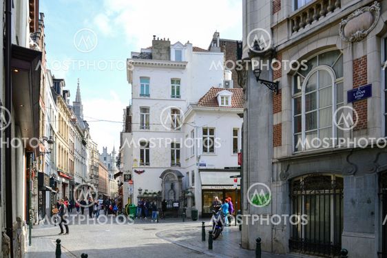 Brussels, Belgium - April 2015: Group of tourists visiting Manneken Pis or Little Man Pee, a landmark small bronze sculpture designed by Hiëronymus Duquesnoy the Elder, located near Grand Place in the city of Brussels, Belgium