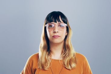 Professional, editor and portrait of woman on gray...