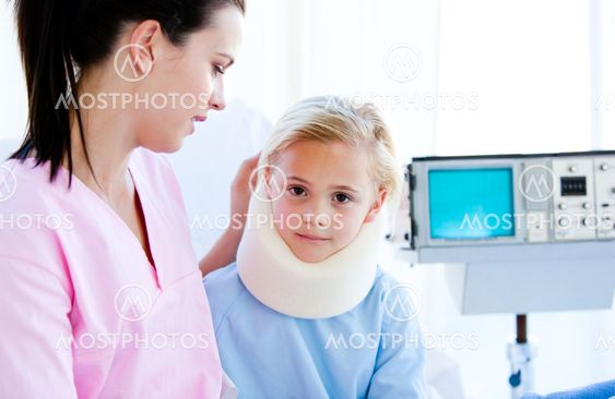Sad little girl with a neck brace sitting with her nurse