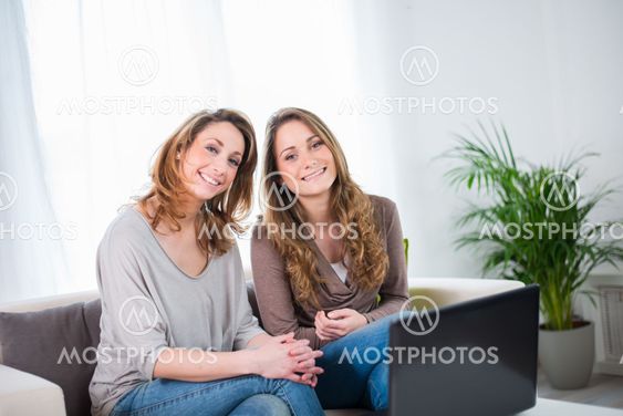 portrait of two beautiful girls at home