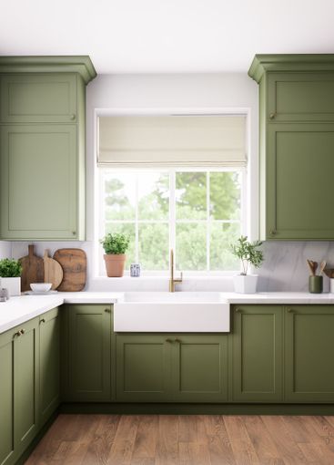 Stylish modern green kitchen with abundant natural light...