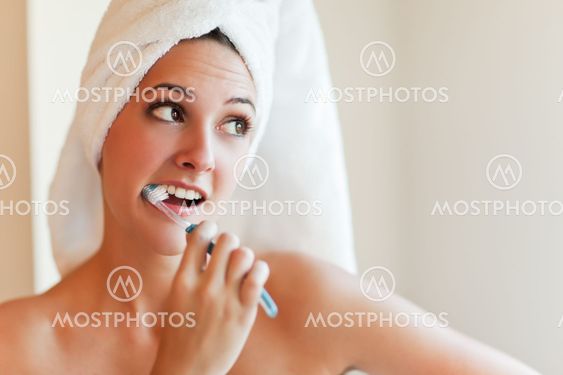 Woman brushing teeth