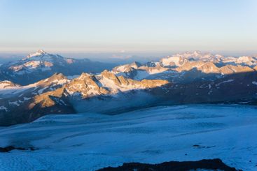 mountain peaks in morning dawn light, panoramic natural...