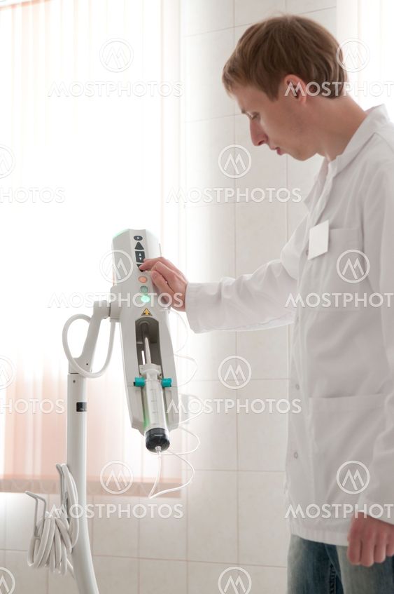 Doctor with CT scan films