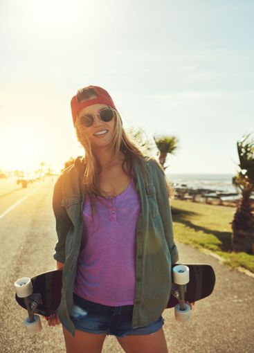 Vacation, road and woman with skateboard, adventure and...