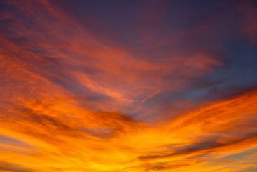 the sky after sunset is adorned with a vibrant mix of...