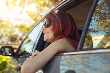 Journey, smile and woman in car for travel, tourism and...