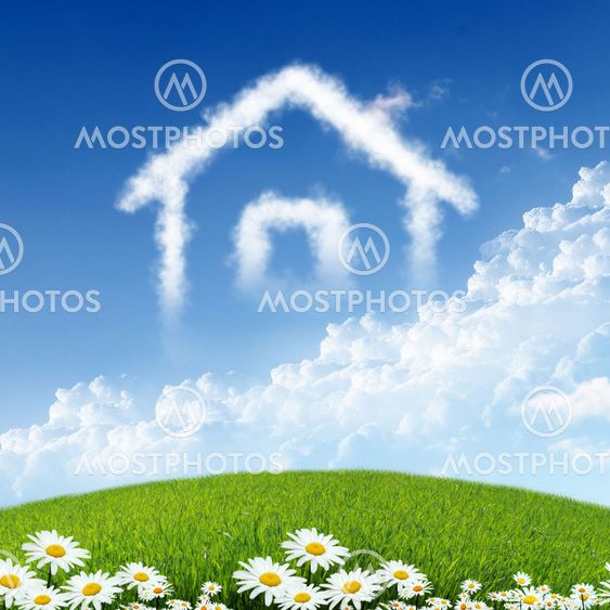 House from white clouds against blue sky