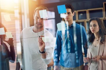 Businessman, writing and collaboration with team on...