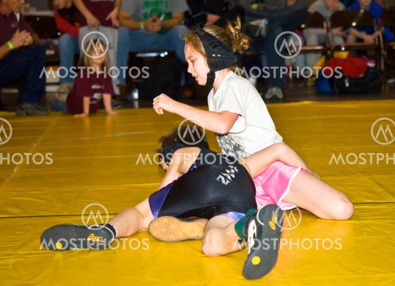 Young Girl and Boy Wrestling