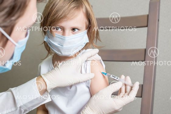 Little child boy or girl is being vaccinated against...