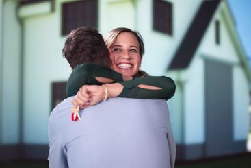 Happy Couple Holding Home Keys