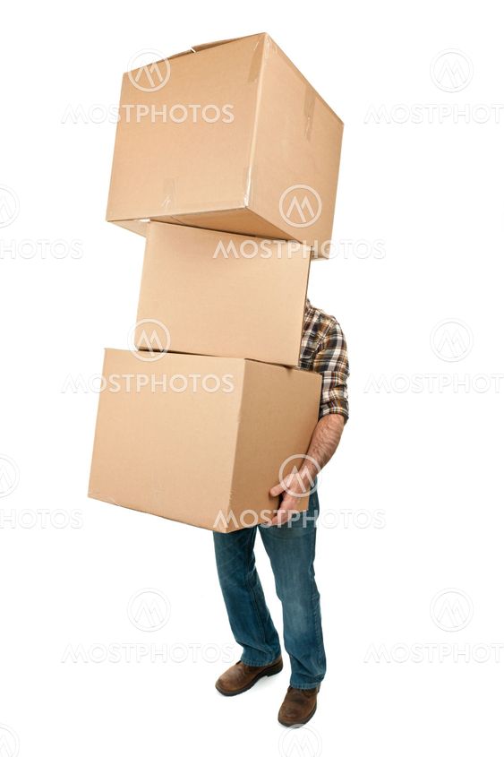 Man carrying stack of cardboard boxes