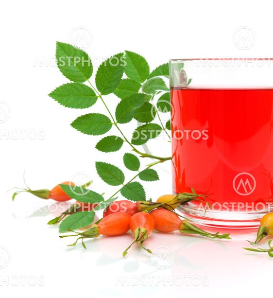 berry wild rose and a cup of tea on a white background