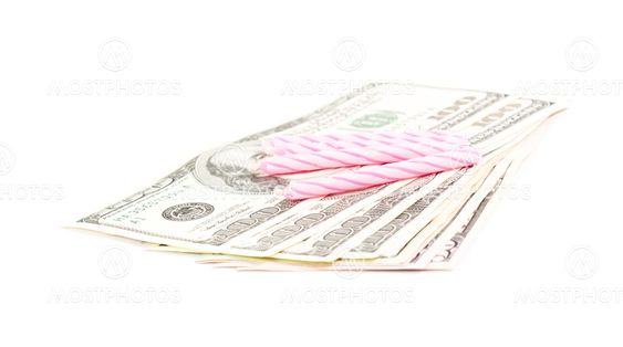 candle and dollars bills with white background