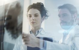 Doctors team examining a patient's x-ray