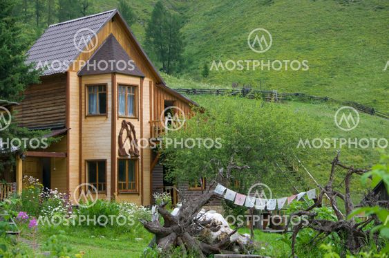 the house wooden among hills and mountains