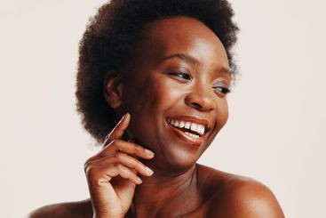 Beauty, skincare and happy with black woman in studio...