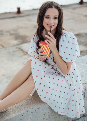 Beautiful fashionable brunette woman in summer dress...