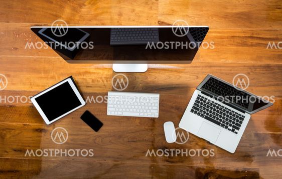 Computer ,laptop , tablet , smart phone on wood table