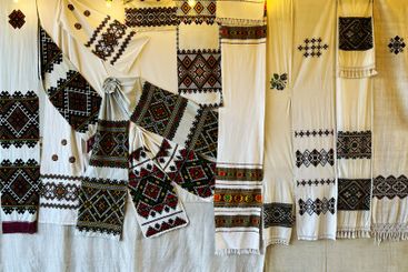 Traditional Embroidered Fabrics Displayed in Vibrant...