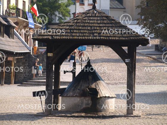 Old wooden well in Old Market Place in Kazimierz Dolny, Poland