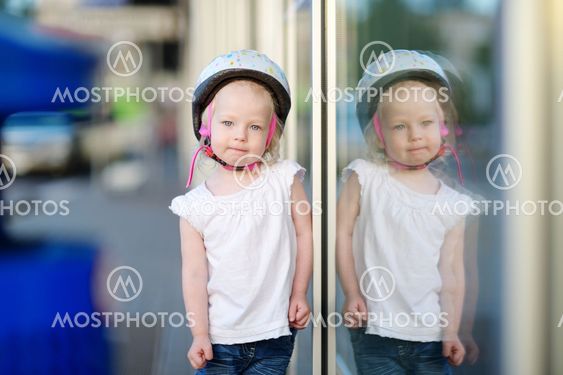 Little toddler girl ready to ride a bike