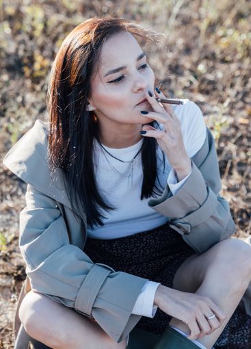 Beautiful fashionable brunette woman in gray coat...