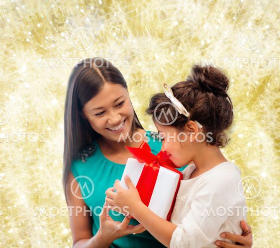happy mother and little girl with gift box