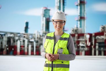 Portrait of young female pipeline technician