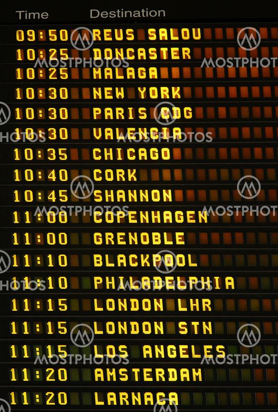 An electronic airport airplane departures board.