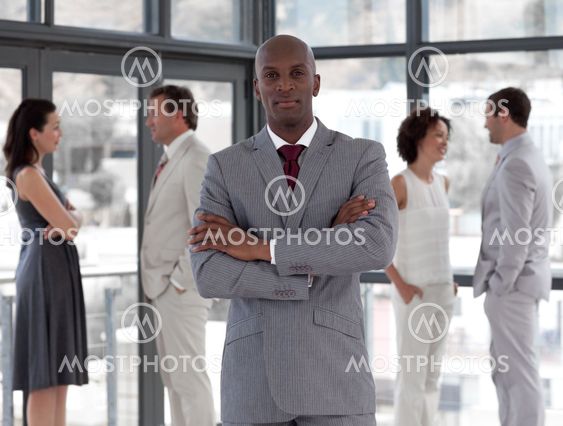 portrait of an african manager leading his team