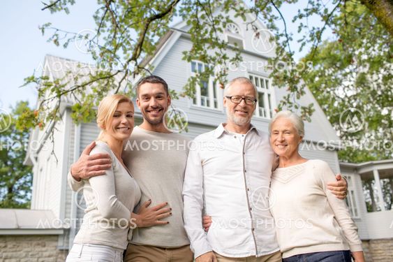 happy family in front of house outdoors