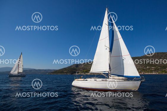 Luxury yachts boats in sailing regatta on the sea.