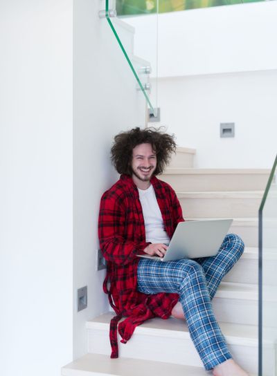 freelancer in bathrobe working from home