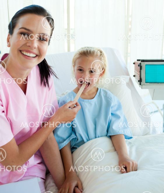 Female doctor checking her patient's throat