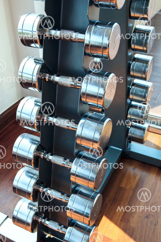 Sports weight dumbbells set in healthy care fitness room use for heathy care and people activities