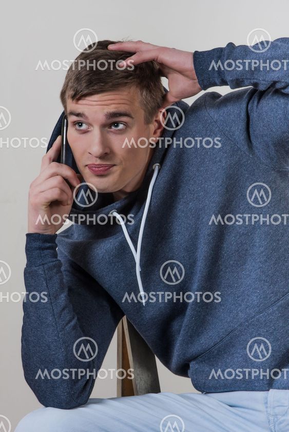 Young man talking on the mobile phone.